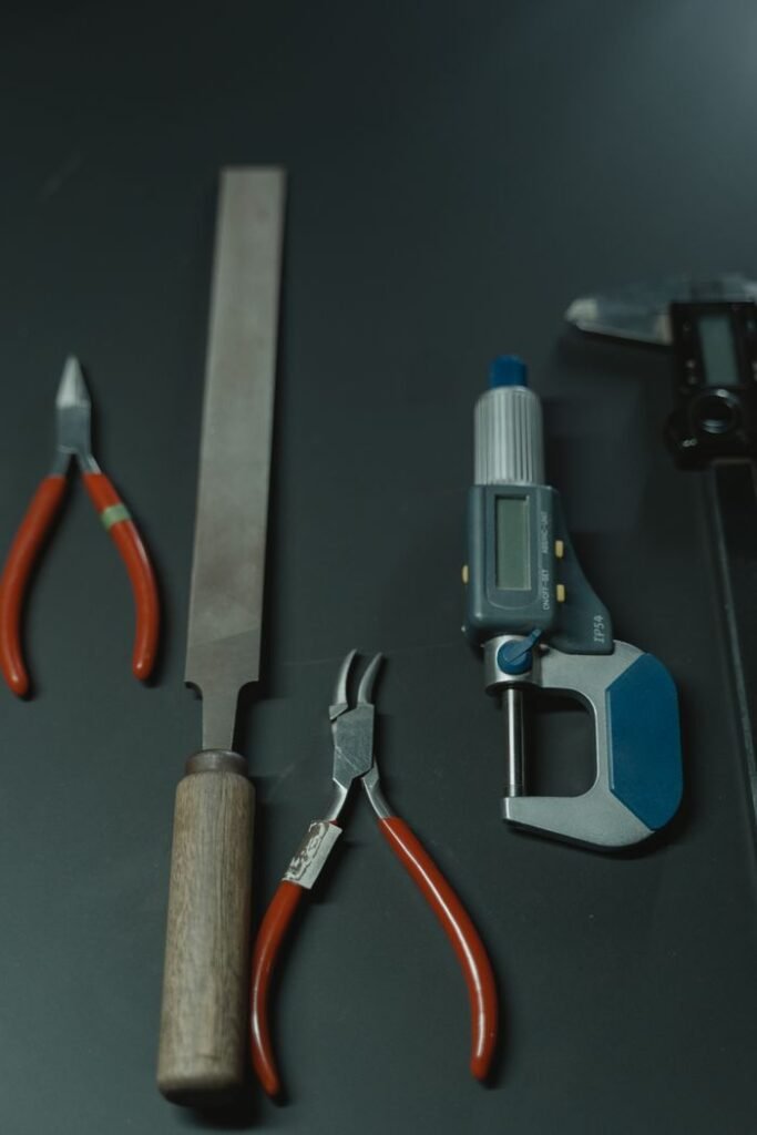 pexels-photo-6262832-6262832 A collection of precision tools on a dark surface, ideal for craftsmanship and woodworking.